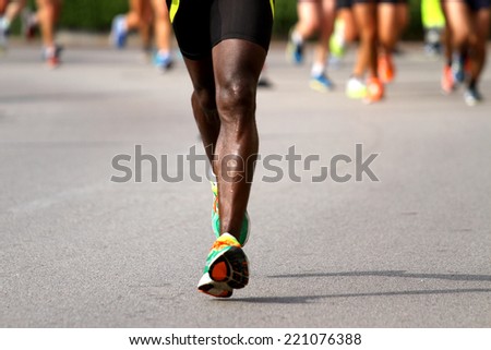 very fast runner with sneakers during the Marathon on road