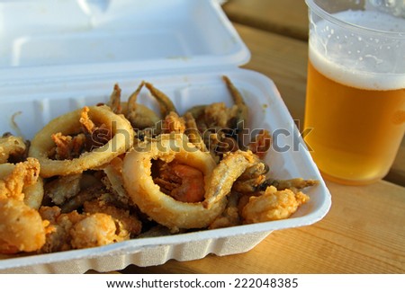 mixed fried fish with shrimp squid and cuttlefish and a cold beer