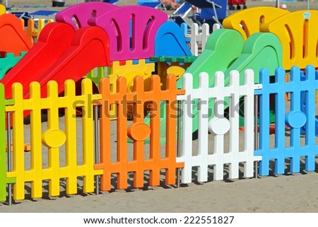 colorful fence a playground on the beach tourist village