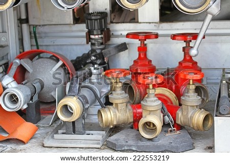 many Sleeve valves and fire lances of trucks of firefighters during a fire drill
