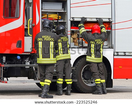 Italian firefighters working near the fire truck when handling an emergency