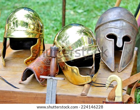 sword and helmets of ancient Roman origin and medieval helmets of brave knights and soldiers