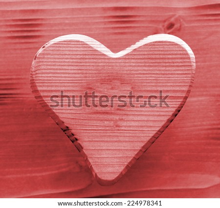 red heart symbol inlaid in wood