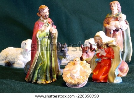 Mary and Joseph with the child Jesus in the manger with a shepherd