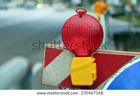 red lamp to signal roadworks and road works in progress