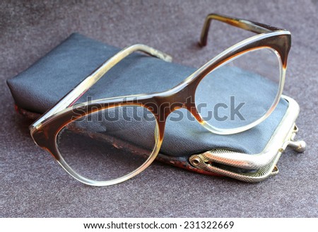 old glasses of a man with black leather case