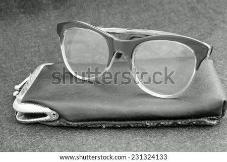 an elderly old glasses with leather case