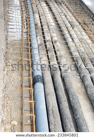 many underground pipes corrugated for optical fiber and power cables