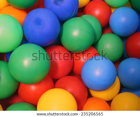 plastic colored balls with vivid colors into a pool of balls