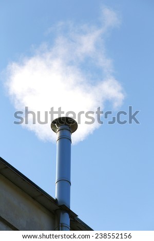 steel chimney smoke of the heating system in winter