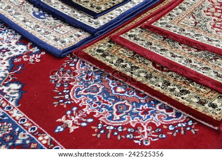 many colored carpets decorated in a mosque