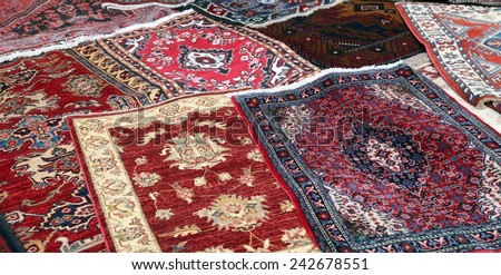 sale of fine Oriental rugs hand knotted in an antique shop
