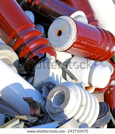 Electrical insulators and old fuses in a landfill of hazardous material