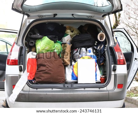 car with the trunk full of luggage during travel
