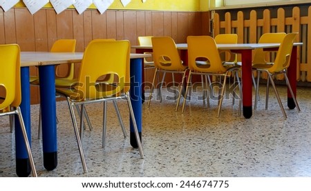 kindergarten classroom with yellow chairs and table