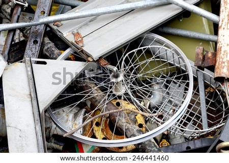 part of  bicycle in the container for the collection of scrap metal