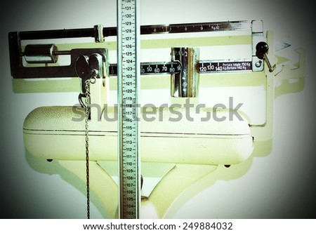 scales with measuring rod for the height and the weight