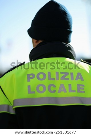 Italian policeman with police uniform patrol the city in winter