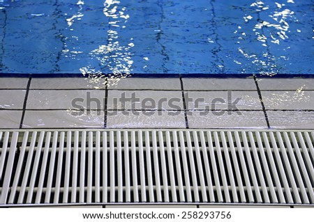 white grid for water circulation in  indoor swimming pool