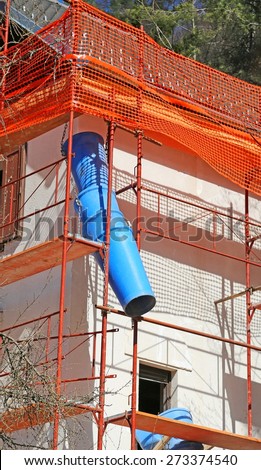 Blue pipe during maintenance work of the building after the earthquake