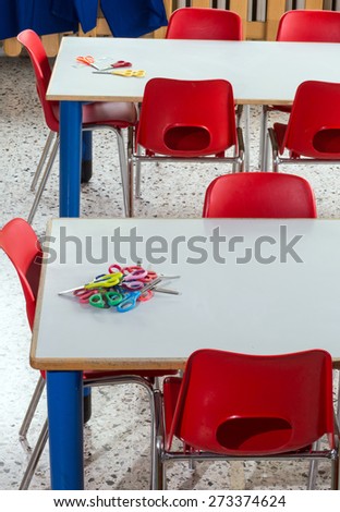 small red chairs in the nursery kindergarten class