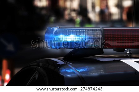 Blue flashing sirens of police car during the roadblock