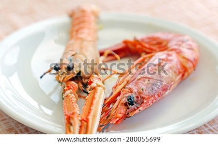 grilled fish with prawn and Norway lobster in the restaurant