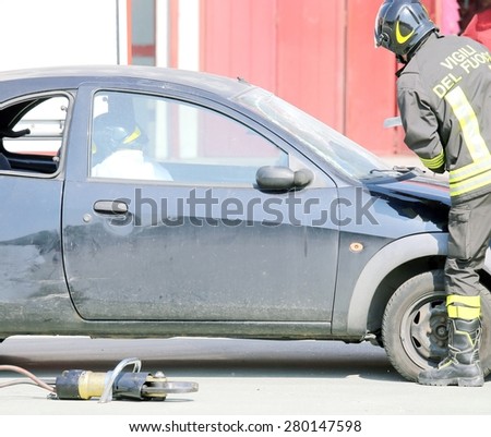 firefighters during training exercise cuts the windscreen of the car