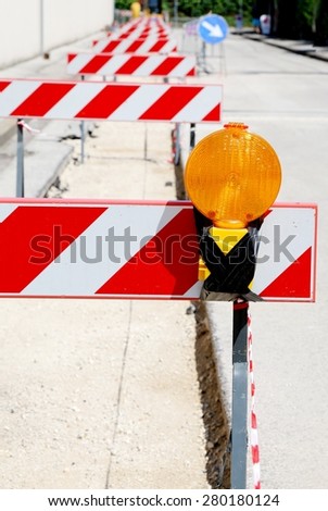 Orange signal road of the site and security hurdles