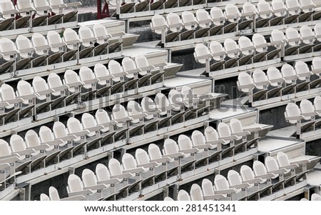 many empty seats in the stands before the sporting event