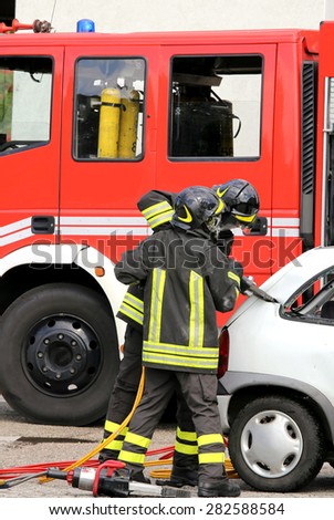brave firefighters relieve an injured after an accident during a practice session in the fire station