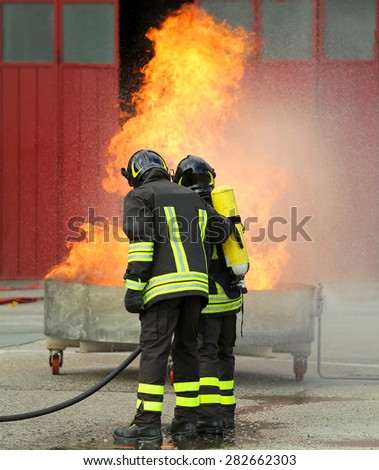 firefighters with oxygen bottles off the fire during a training exercise in Firehouse
