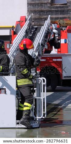 fireman in the cage of fire engine
