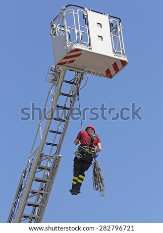 expert firefighters hung the rope climbing during the practical exercise in fire station