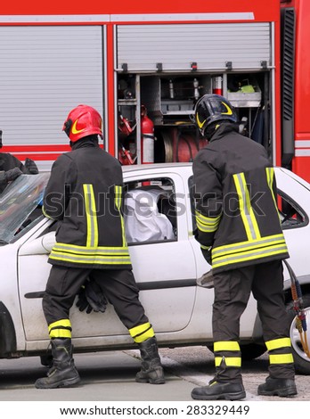 firefighters in action after the road accident