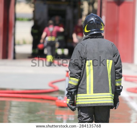 isolated Italian fireman with protective uniform and helmet