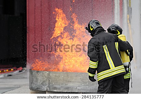 firefighters with oxygen bottles off the fire during a training exercise in Fire hall