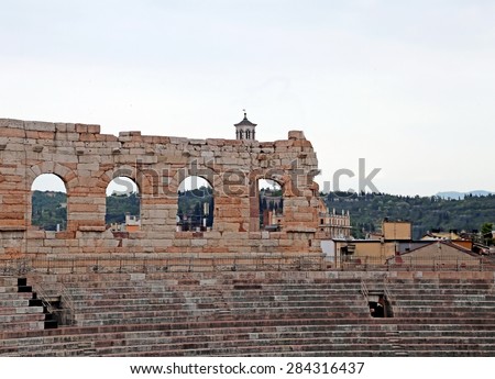 Wall of ancient Arena di Verona and the bleachers to watch the shows