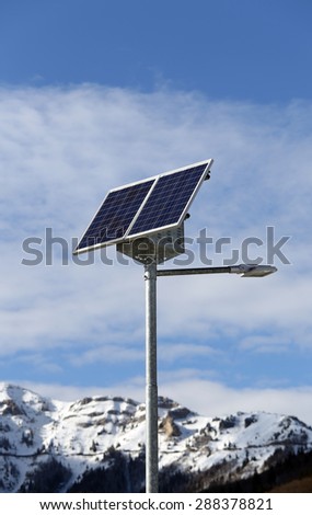 Solar energy Street lamp with the last generation photovoltaic cells in a mountain in winter