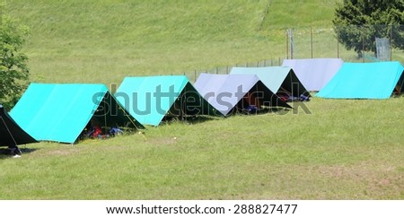 boy scout camp with large tents to sleep during the summer camp