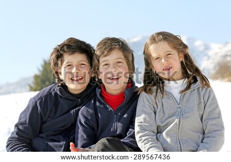 Portrait of smiling Caucasian three brothers in winter