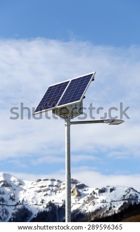 Solar energy Street lamp with the last generation photovoltaic cells in a mountain in winter