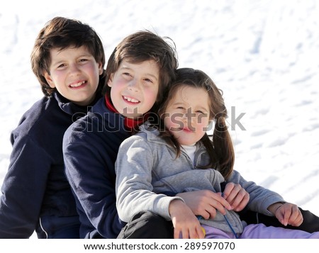 European family portrait with three brothers two males and one female in winter