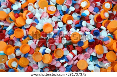 collection of colourful plastic stoppers in landfills recyclable waste