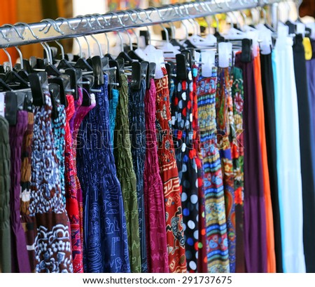 used clothes and dresses for women in vintage style for sale at flea market