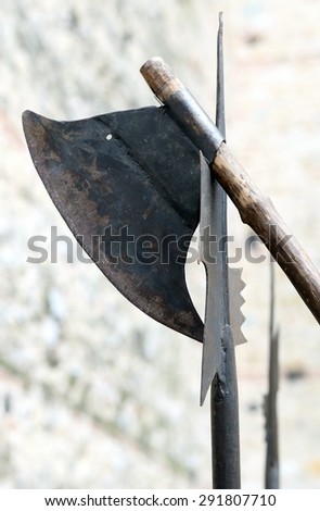 ancient axe and medieval halberd during combat in the Castle