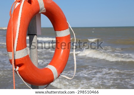 Orange jackets with rope to rescue swimmers in the sea in summer