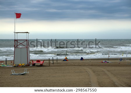 Lifeguard Tower on the beach with the sea very rough and agitated after the storm