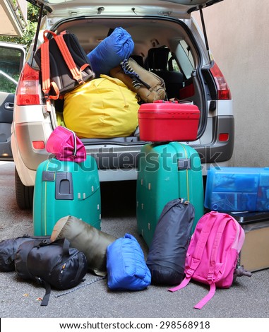 luggage and suitcases in car for departure for summer holidays
