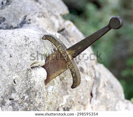 excalibur the famous sword in the stone of king Arthur in the forest